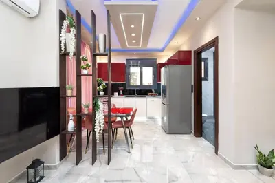 a kitchen with a table and chairs in a room at Lux City Apartment in Rhodes Town