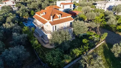 an overhead view of a large house with a red roof at Villa George Rhodes in Archangelos