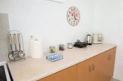 a kitchen counter with many appliances on it at Atlantic Cave Haven-Seaside, Fully Equipped in Kolimbia