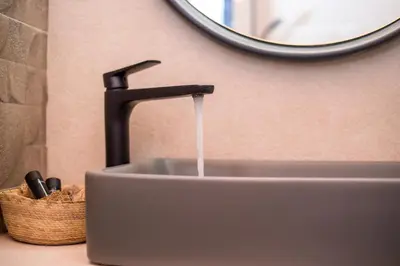 a sink with a faucet with water coming out at The Knight's House Old Town Rhodes in Rhodes Town