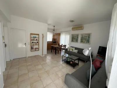 a living room with a couch and a table at Secret Edem in Kolimbia