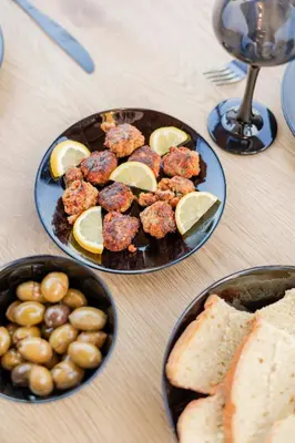 a table with two plates of food and bread at Villa Tranquility in Psinthos