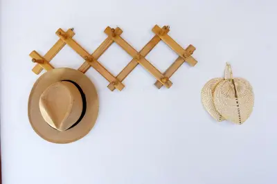 a hat and a wooden hanger on a wall at Teresa's Home in Líndos