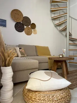 a living room with a couch and a table at Celestia Apartments in Halki