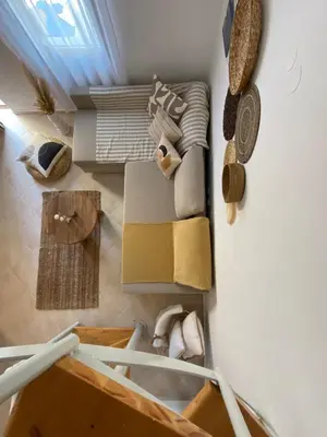 a living room with a couch and a table at Celestia Apartments in Halki