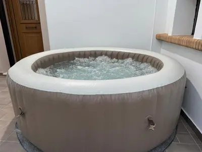 a large bath tub in a room with at Traditional House Leventis in Archangelos