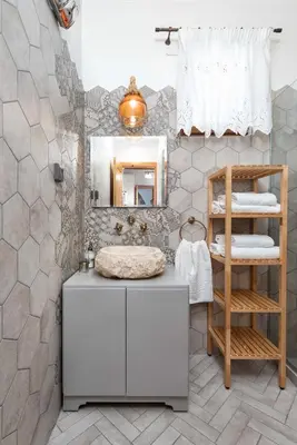 a bathroom with a sink and a mirror at Traditional House Leventis in Archangelos