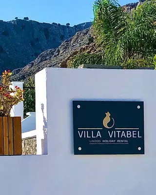 a sign for a villa villelez on a wall at Villa Vitabel sea view in Lindos in Líndos