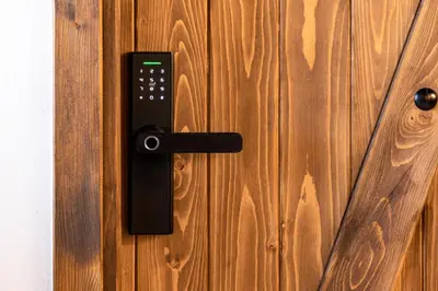 a black door handle on a wooden door at Ancient Knights Luxury Suites in Rhodes Town