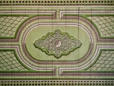 an ornate design on the ceiling of a building at 1900 Hotel in Symi