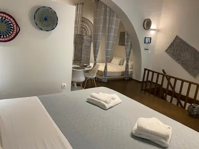 a bedroom with a bed with two towels on it at Rhodes Old Town Harmony Suite in Rhodes Town