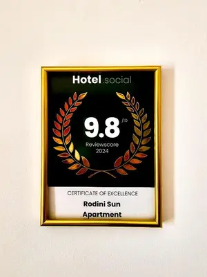 a framed picture of a h hotel social sign at Rodini Sun Apartment in Rhodes Town