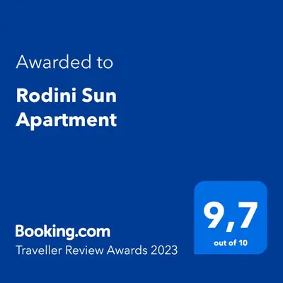a blue sign with the text awarded to robin sun appointment at Rodini Sun Apartment in Rhodes Town