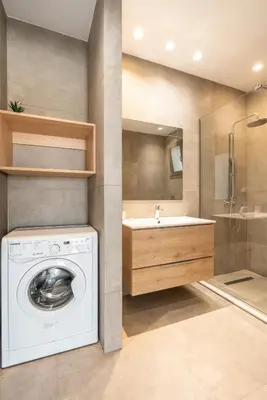 a bathroom with a washing machine and a sink at Kiotari Fresh in Kiotari
