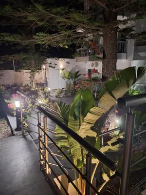 a room with a bunch of plants in it at POUNEDES LUXURY SUITES in Pefki Rhodes