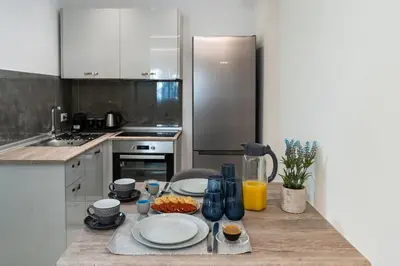 a kitchen with a table with food on it at POUNEDES LUXURY SUITES in Pefki Rhodes