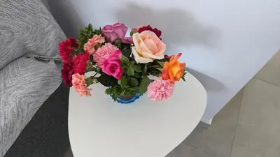 a bouquet of flowers in a vase on a table at KIRA'S RESIDENCE PANORAMIC VIEW in Archangelos