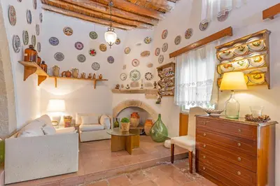 a living room with a couch and a table at Hidden Gem of Afandou , Traditional House & Patio in Afantou