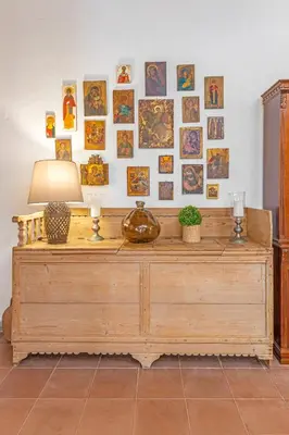 a wooden dresser with a lamp on top of it at Hidden Gem of Afandou , Traditional House & Patio in Afantou