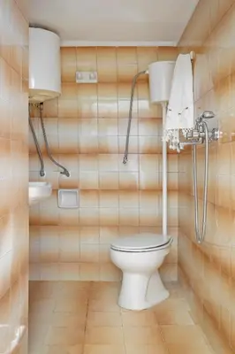 a bathroom with a toilet and a sink at Hidden Gem of Afandou , Traditional House & Patio in Afantou