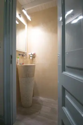 a bathroom with a sink and a mirror at Villa Sylvia in Symi