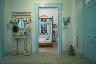 a hallway with a room with a room with a bed at Villa Sylvia in Symi