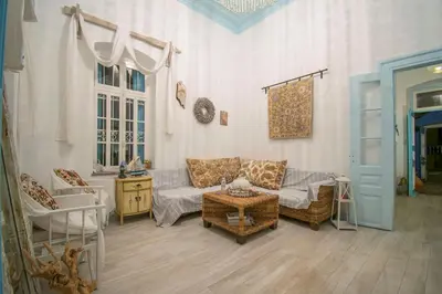 a living room with a couch and a table at Villa Sylvia in Symi