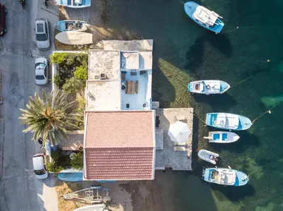 an overhead view of boats parked in the water at Villa Sylvia in Symi