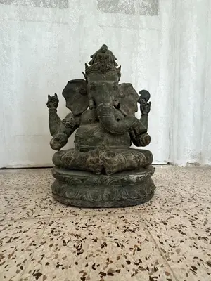 a statue of an elephant with two cats on it at Tower Traditional Pool Villa in Kremasti