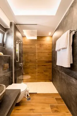 a bathroom with a shower and a toilet and a sink at Megusta Suites in Theologos