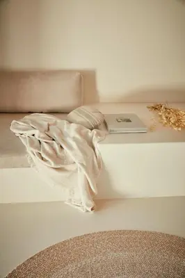 a table with a laptop and a blanket on it at AF Lindia Nature Design Hotel in Líndos