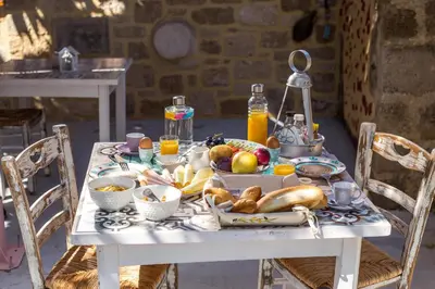 a white table with fruit and vegetables on it at Attiki Hotel in Rhodes Town