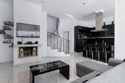 a living room with a couch and a table at Diamond Villa in Gennadi