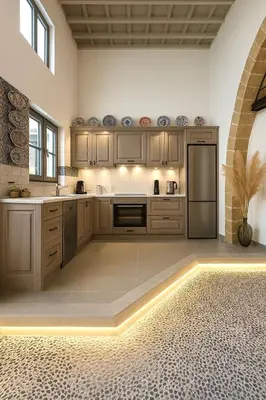 a kitchen with wooden cabinets and a stainless steel refrigerator at Heliareti Traditional House in Koskinou