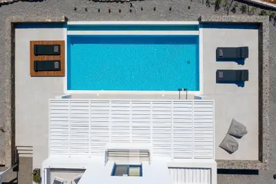 an overhead view of a swimming pool on a building at Astrea Villas in Lachania
