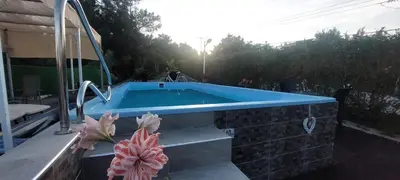 a swimming pool with a blue poolvisor at Nila's Villa in Koskinou