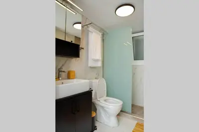 a bathroom with a toilet and a sink at Potnia House in the center of Rhodes in Rhodes Town