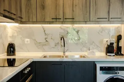 a kitchen with a sink and a marble counter top at Potnia House in the center of Rhodes in Rhodes Town