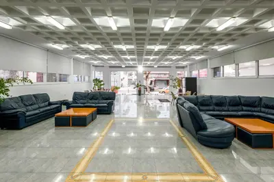 a lobby with couches and tables in a building at ISKAS EVILION in Rhodes Town