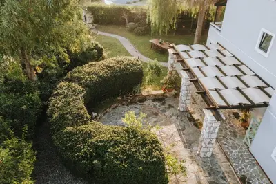 an overhead view of a bench in a garden at Never Ending Summer Villa in Asgourou