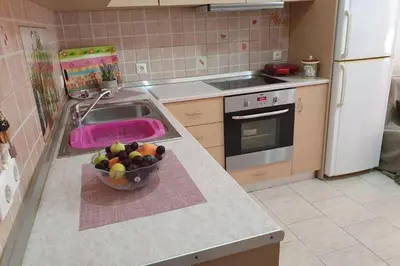a kitchen with a bowl of fruit on a counter at Amarantou Apartment - Rhodes City Center in Rhodes Town