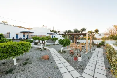 a garden with a playground and trees at Kalathos Square luxury suites in Kalathos