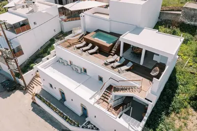 an aerial view of a house with a swimming pool at Kalathos Square luxury suites in Kalathos