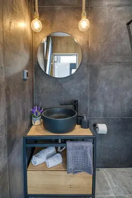 a bathroom with a sink and a mirror at Terra Secreta Luxury Villas in Lardos