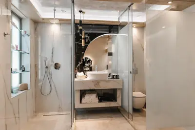 a bathroom with a sink and a mirror at Chateau Anax Luxury suites in Rhodes Town