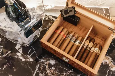 a wooden box full of cigars on a table at Chateau Anax Luxury suites in Rhodes Town