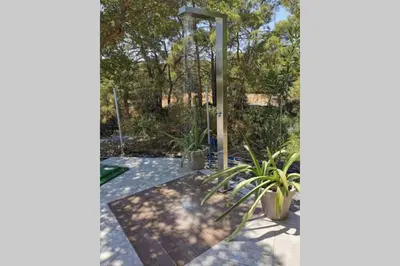 a garden with a gazebo and plants at Fiore di Rodi - Private Pool, Jacuzzi and Barbecue in Ialyssos