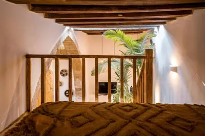 a bedroom with a bed in a room with a window at CasaCarma I, privater Pool, Boho-Design, Tradition in Lachania
