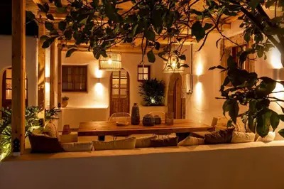 a living room with a couch and a wooden table at CasaCarma I, privater Pool, Boho-Design, Tradition in Lachania