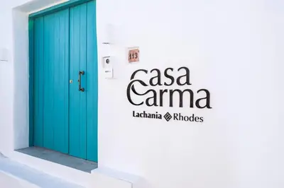 a blue door on the side of a building at CasaCarma I, privater Pool, Boho-Design, Tradition in Lachania